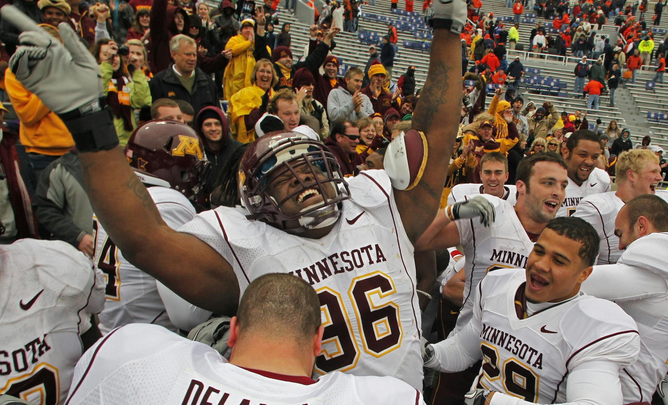 Defensive tackle Brandon Kirksey (96) celebrated the victory over Illinois with his Gophers teammates after the game.
