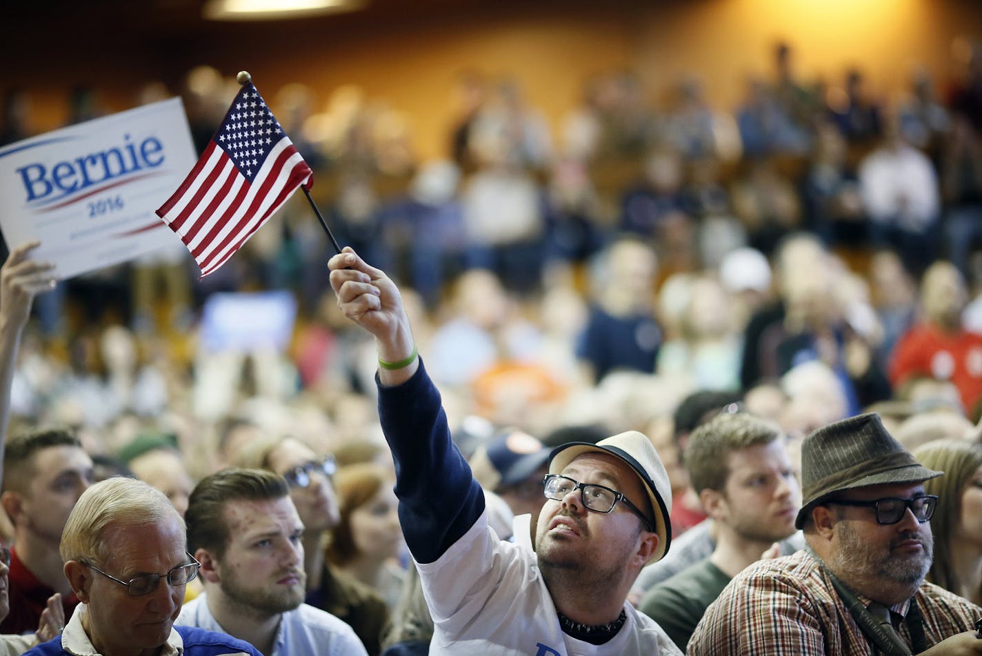 Christopher Krauss waves an American flag during a rally for Sen. Bernie Sanders at the American Indian Center on Sunday, May 31, 2015, in Minneapolis. (Jerry Holt/Minneapolis Star Tribune/TNS) ORG XMIT: 1168799