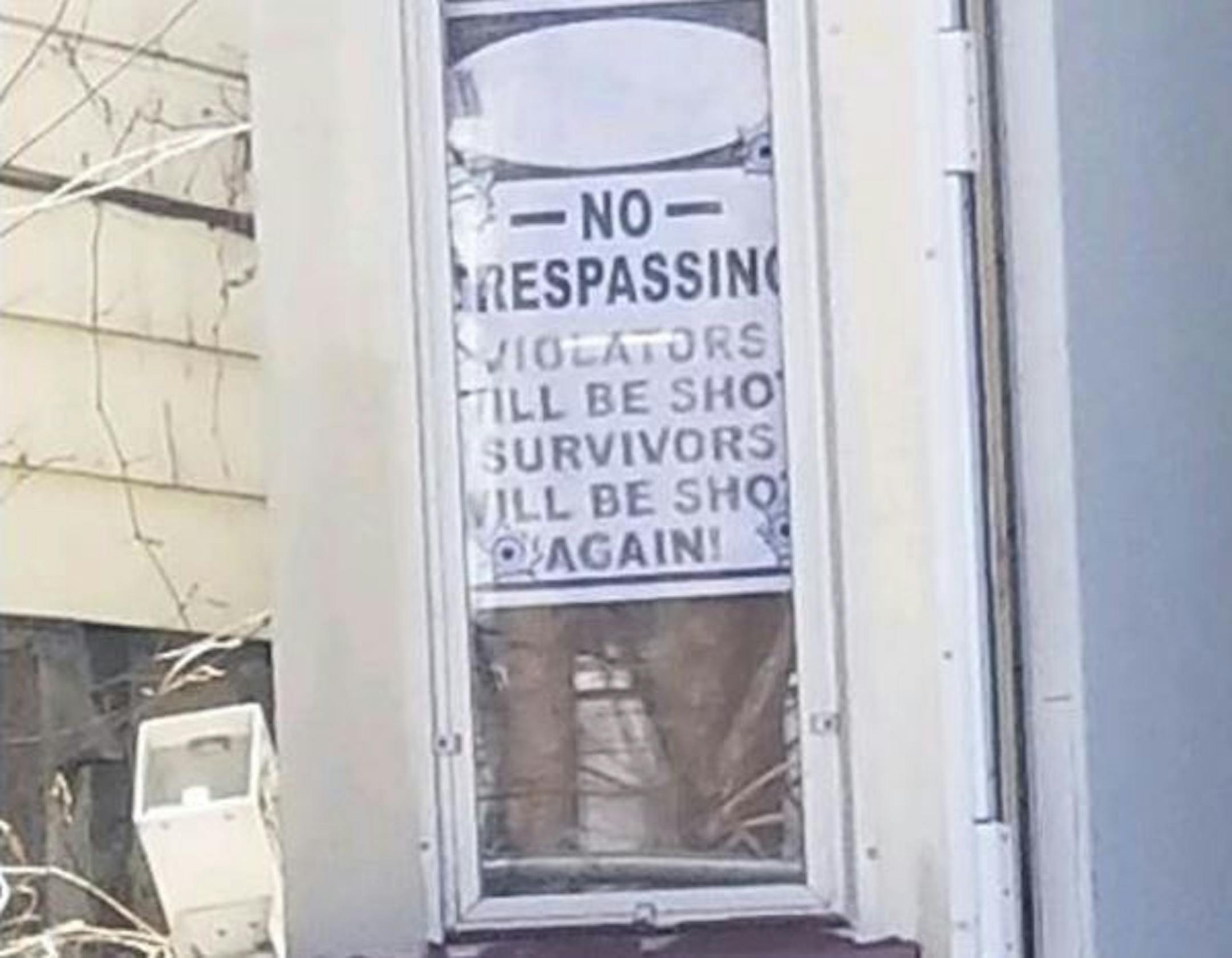 This sign was on the house where a homeowner shot a man fleeing police in St. Paul. Credit: Shannon Prather/Star Tribune