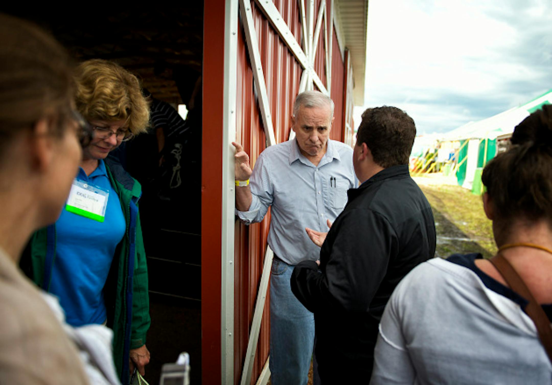 Governor Mark Dayton listened to a constituent after he delivered the keynote speech at Farmfest the outstate agricultural trade show held each year at Gilfillian Estate in Redwood County, Minnesota,  Thursday August 8, 2013   ]   GLEN STUBBE * gstubbe@startribune.com