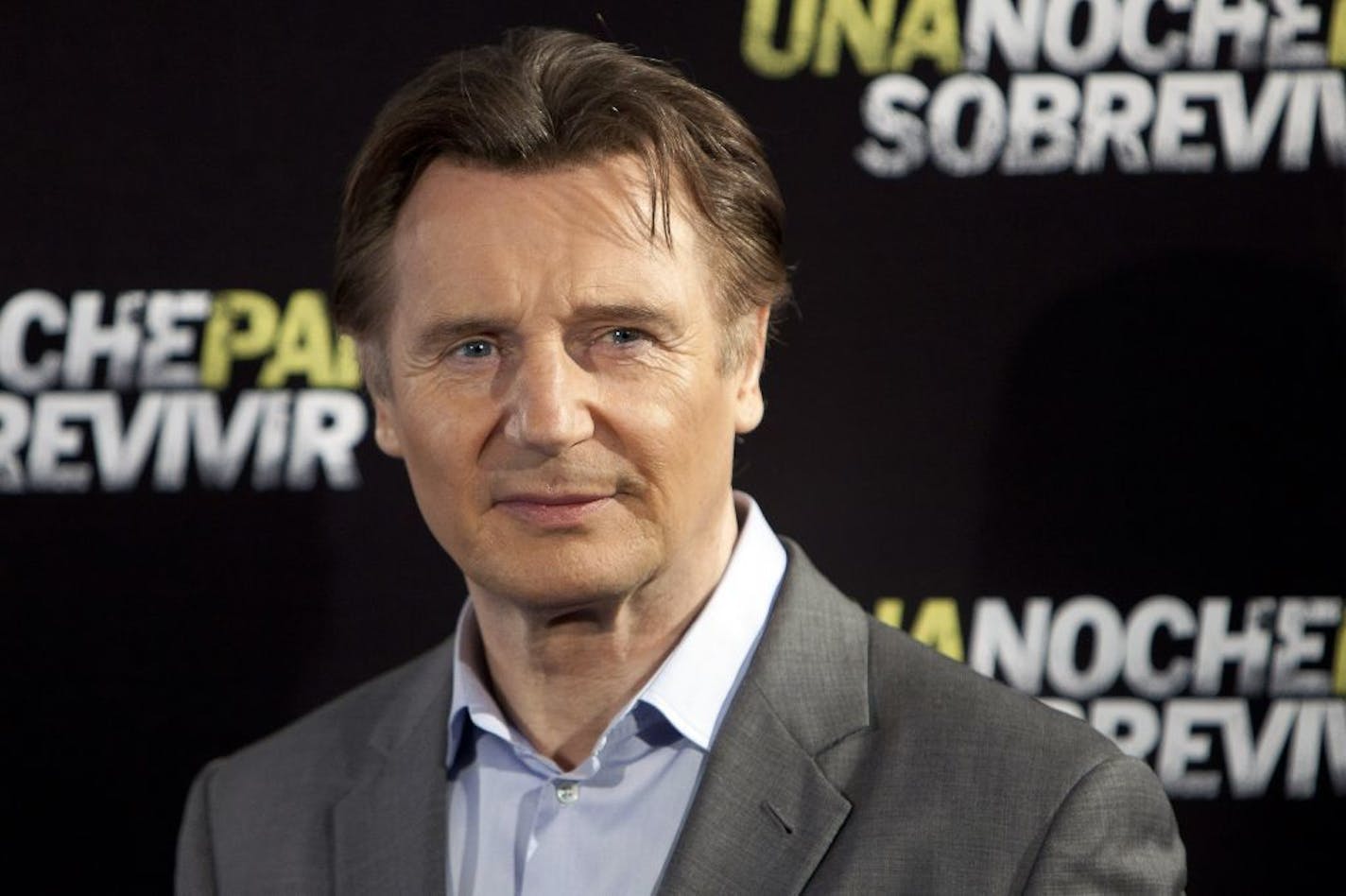 In this March 24, 2015 file photo, actor Liam Neeson poses for photographers during the presentation of the film "Run All Night" in Madrid.