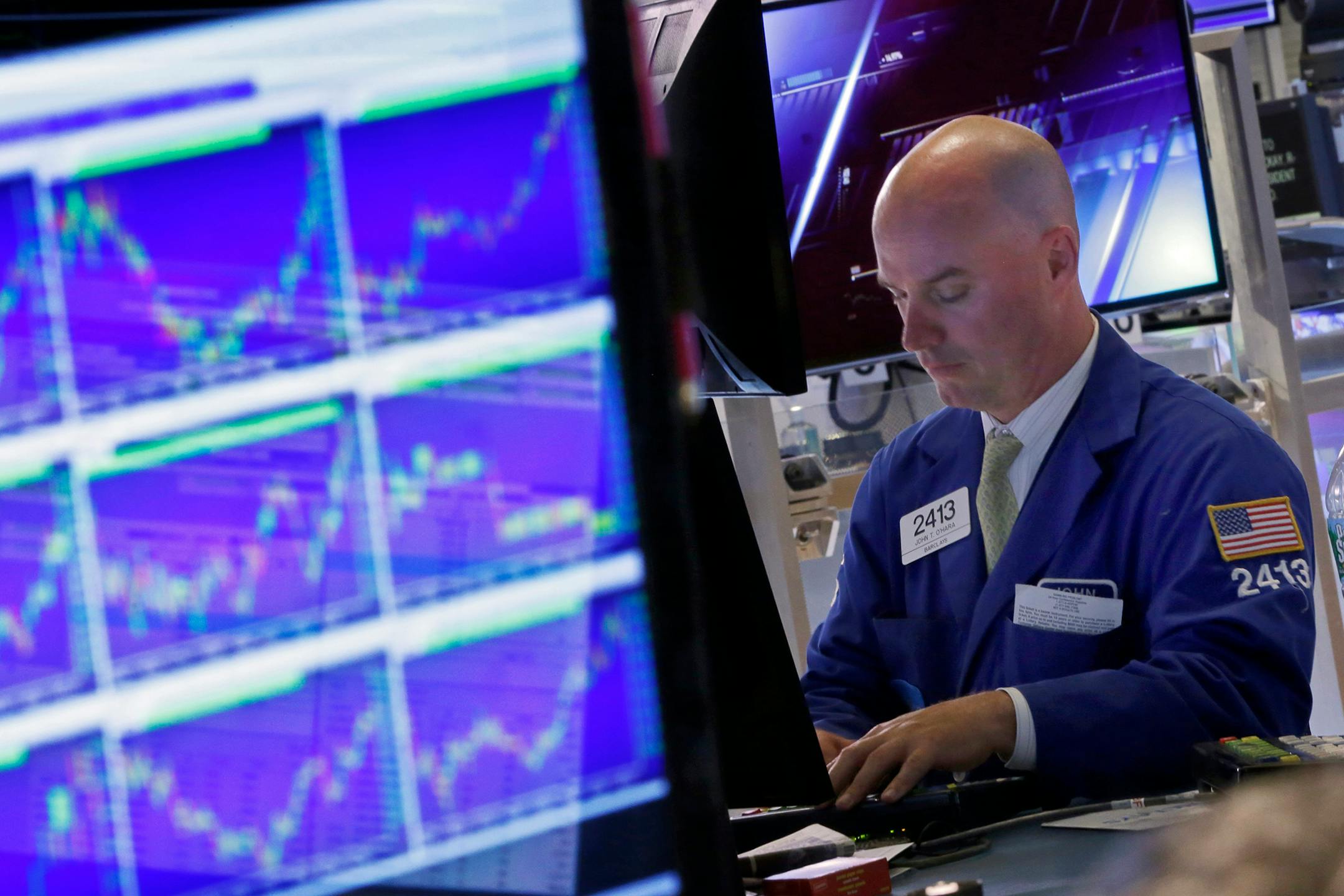 It was a turbulent week for the markets; here, specialist John O'Hara worked at his post on the floor of the New York Stock Exchange.