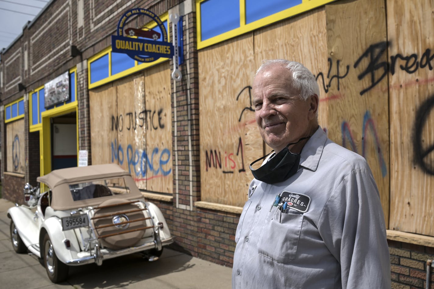 Mark Brandow, owner of Quality Coaches auto shop, stood for a portrait outside the shop, still boarded up, on Thursday, Aug. 20, 2020 in Minneapolis, Minn. ] aaron.lavinsky@startribune.com Mark Brandow never wanted security shutters on the windows of his car repair shop in Minneapolis until rioters smashed into hundreds of other small businesses in May, including a car repair shop 2 blocks away. Brandow is spending $25,000 to put up the shutters, but he's mad city won't let him put them on outsi