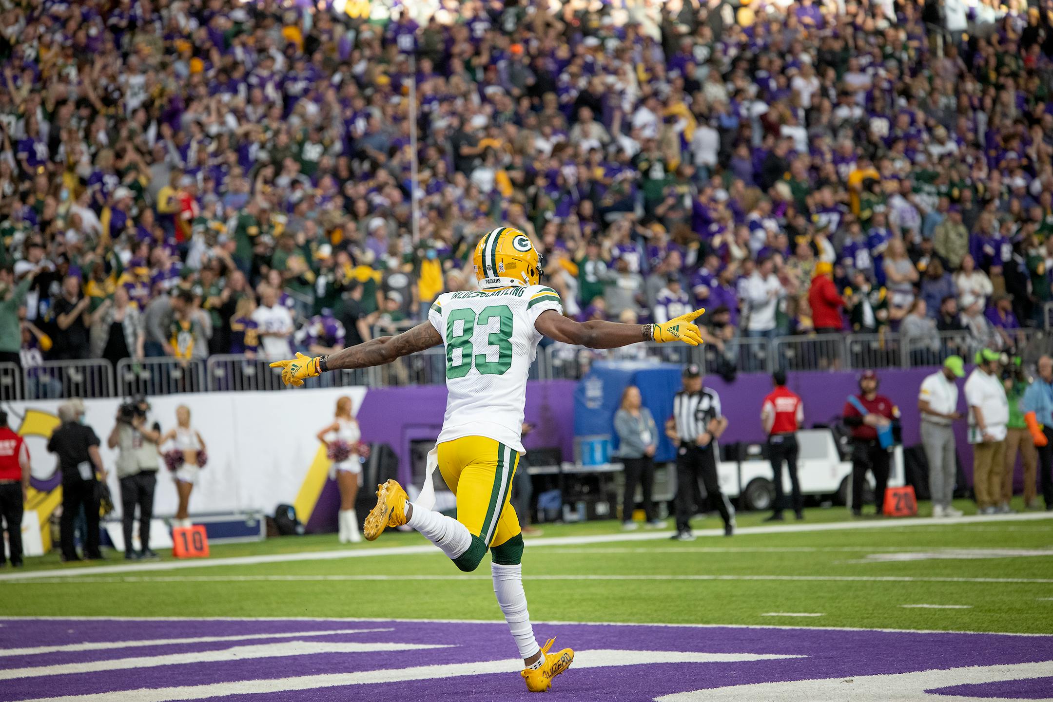 Packers wide receiver Marquez Valdes-Scantling (83) celebrated after he broke away from Vikings free safety Xavier Woods (23) and ran a 75-yard touchdown during the fourth quarter.