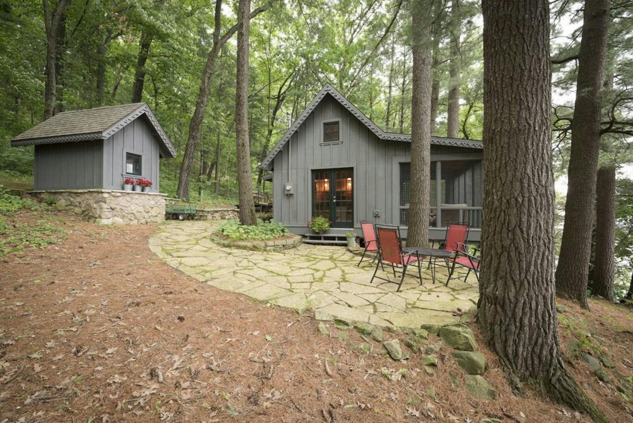 This property on the Wisconsin side of the St. Croix river is a compound with three seasonal cabins and a large shed with its own an apartment inside.
