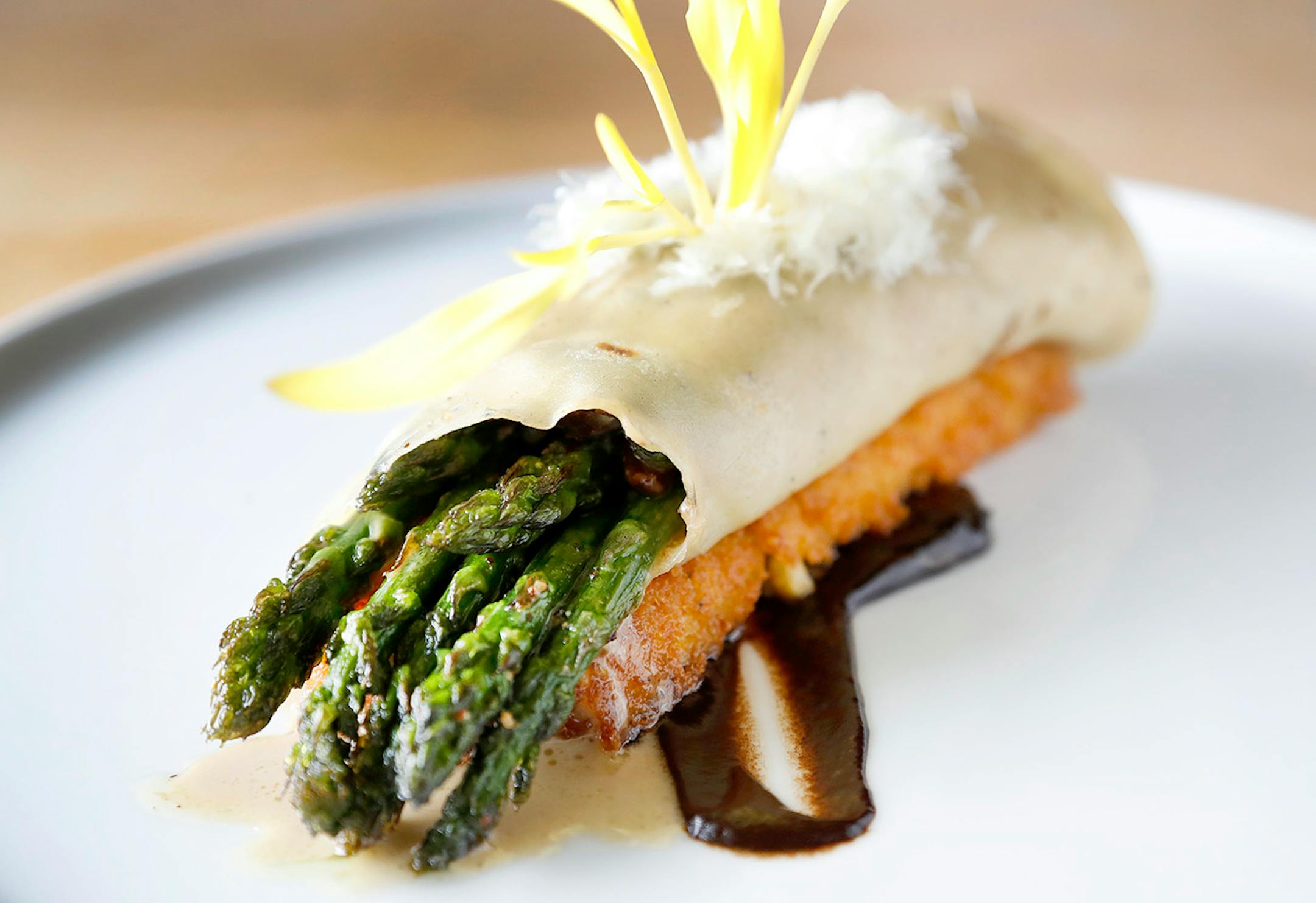 Wild Mushroom Crepe. Polenta, black garlic, cream sherry, romano, mascarpone, asparagus and popcorn shoots at the New Scenic Cafe up the shore north of Duluth.