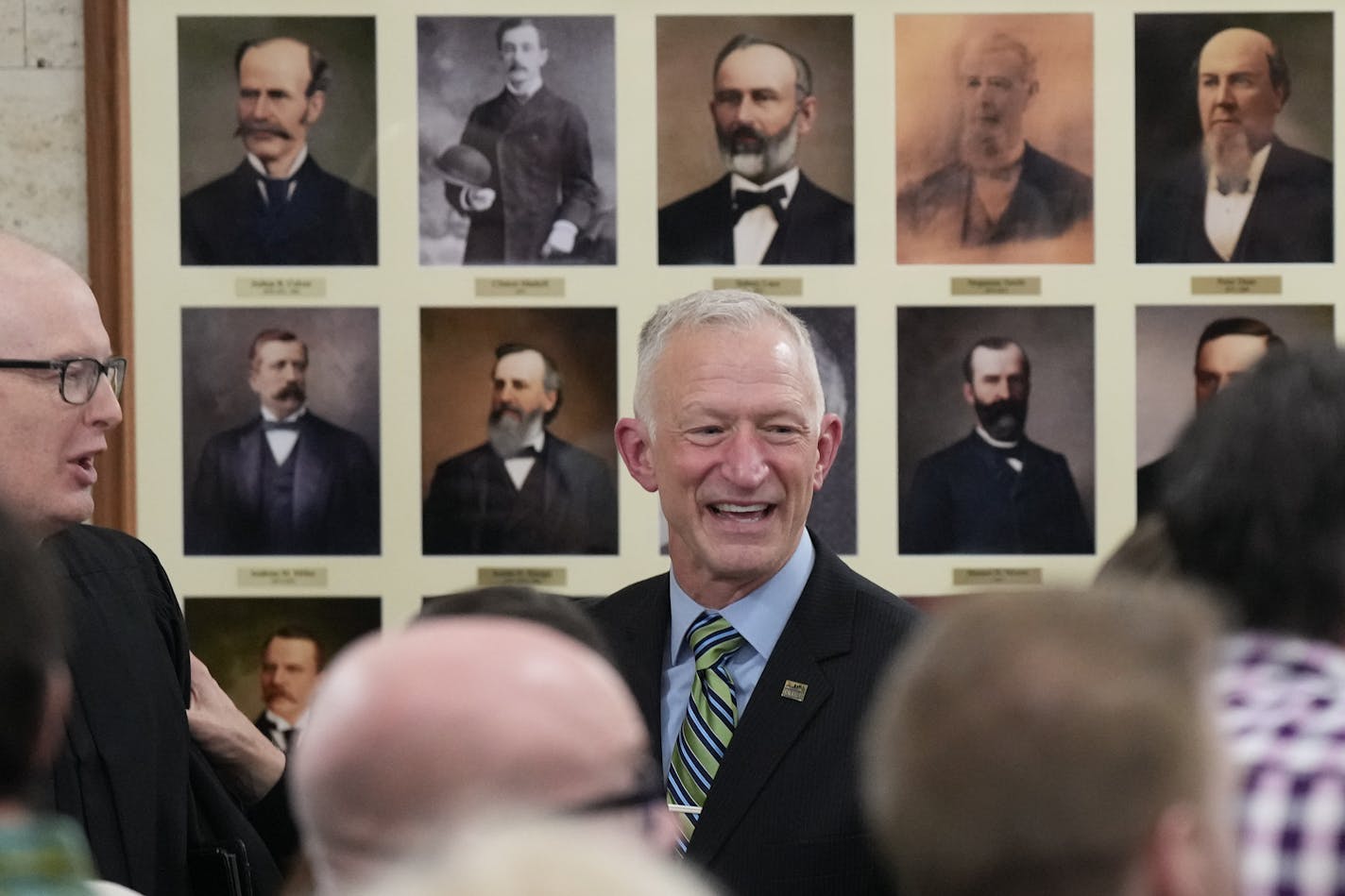 Roger Reinert stood in front of some of the forty Duluth mayors who came before him after adressing the crowd at his swearing in ceremony Tuesday, Jan. 2, 2024 Duluth, Minn. ] GLEN STUBBE • glen.stubbe@startribune.com