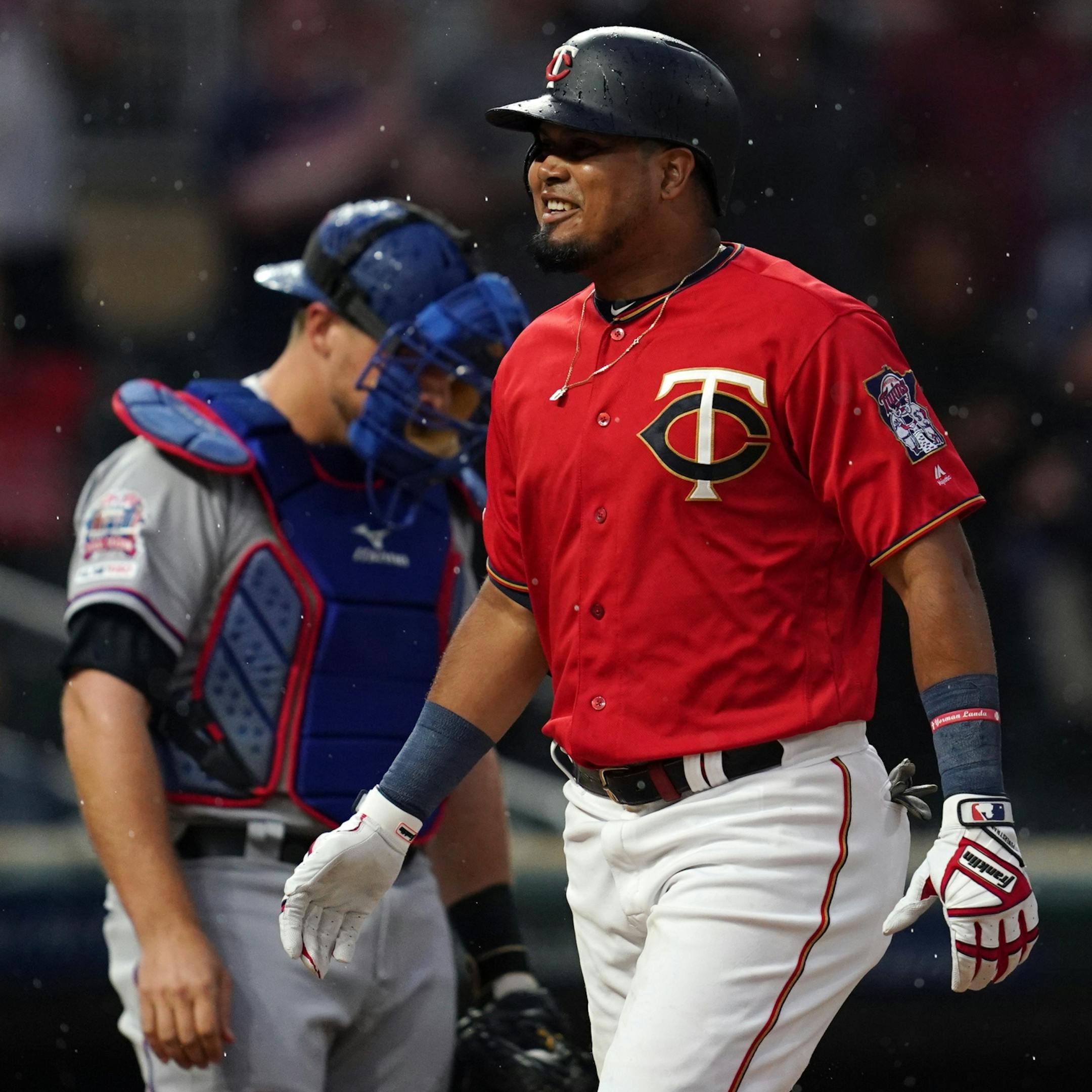 Minnesota Twins third baseman Luis Arraez (2) smiled as he crossed home plate after hitting a home run in the second inning.