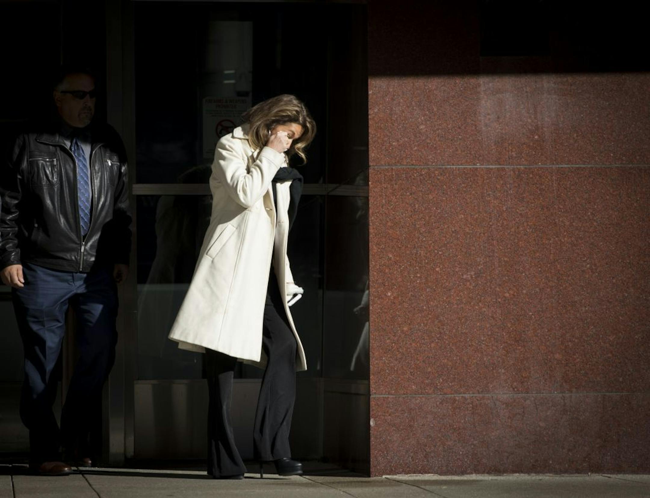 A woman left the U.S. Courthouse wiping her eyes on Monday morning shortly after the sentencing of Danny Heinrich on November 21, 2016, in Minneapolis, Minn.