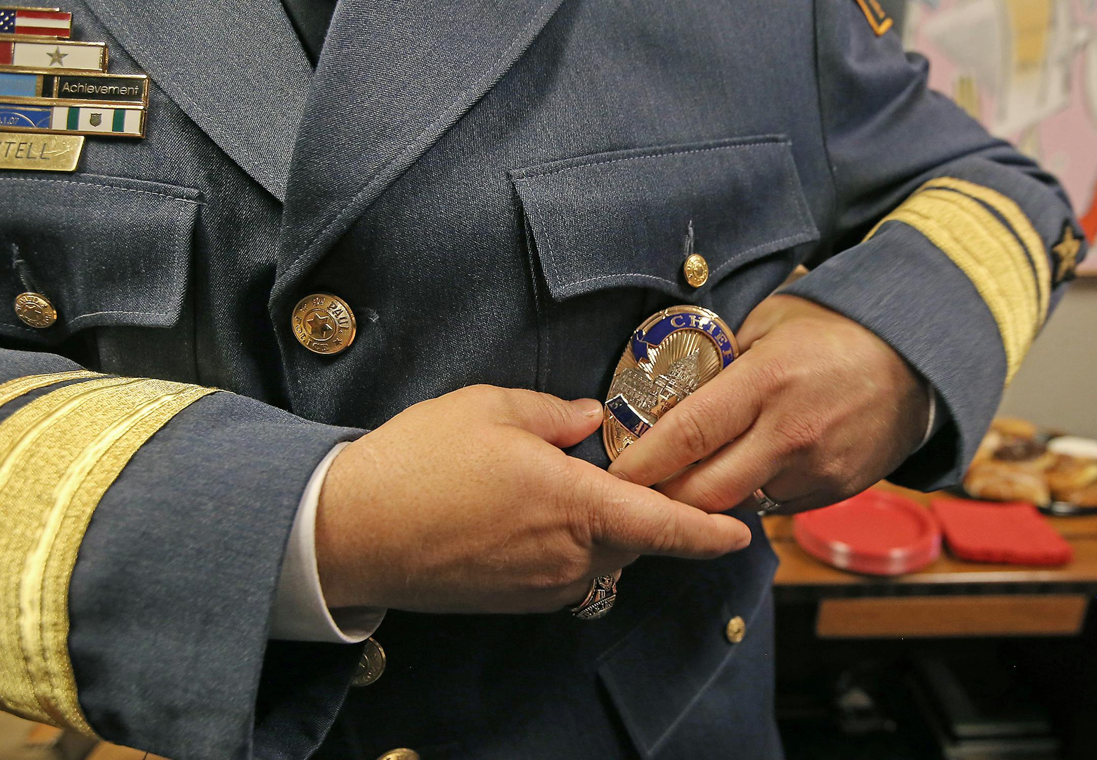 St. Paul Police Chief Todd Axtell adjusted his badge after he was officially sworn in at Mayor Chris Coleman's office, Thursday, June 23, 2016 in St. Paul, MN. ] (ELIZABETH FLORES/STAR TRIBUNE) ELIZABETH FLORES • eflores@startribune.com