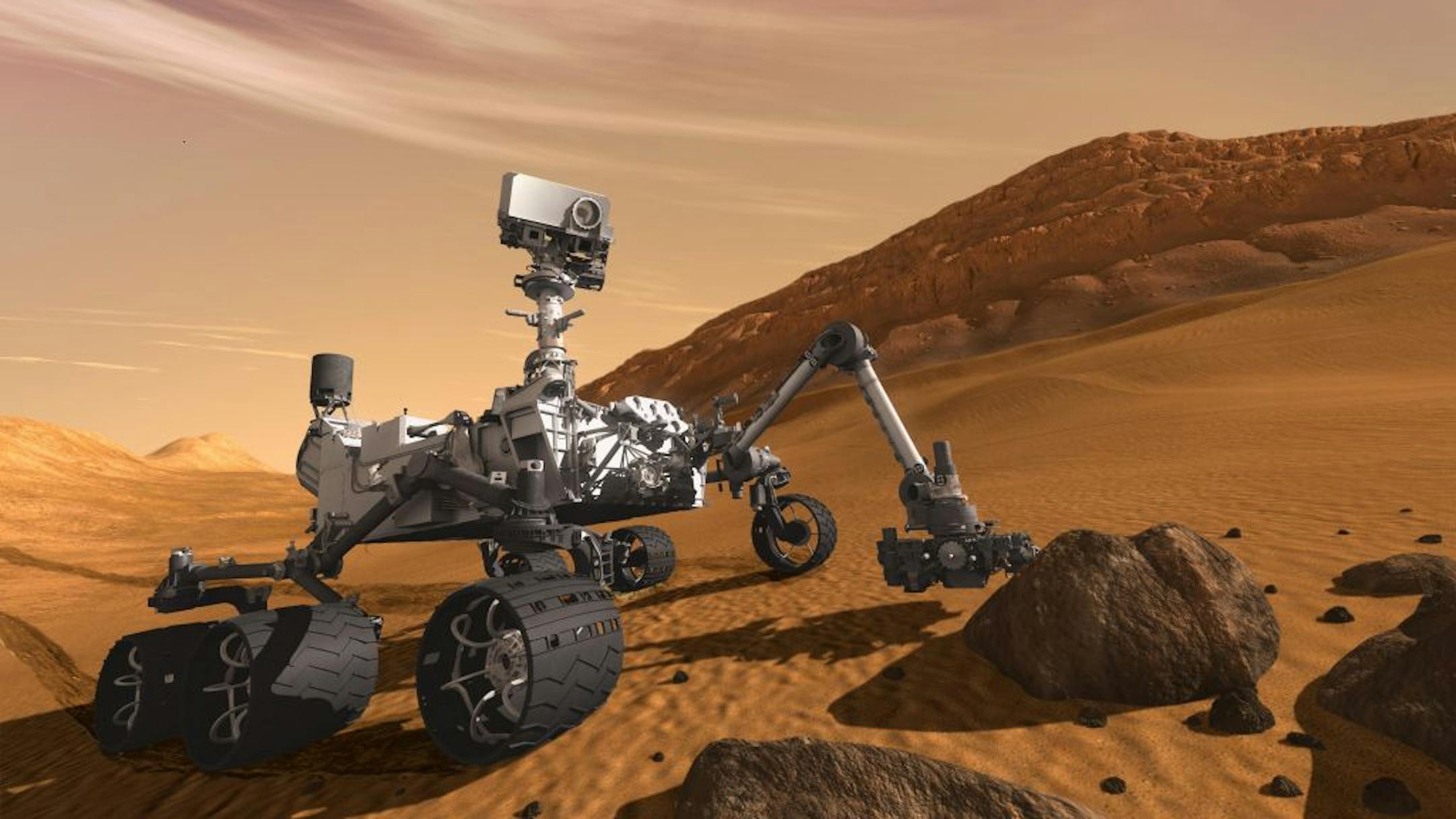 In this artist's rendering, the Mars rover Curiosity examines a rock on Mars with a set of tools at the end of its arm, which extends about 7 feet. Its latest findings will be announced Monday.