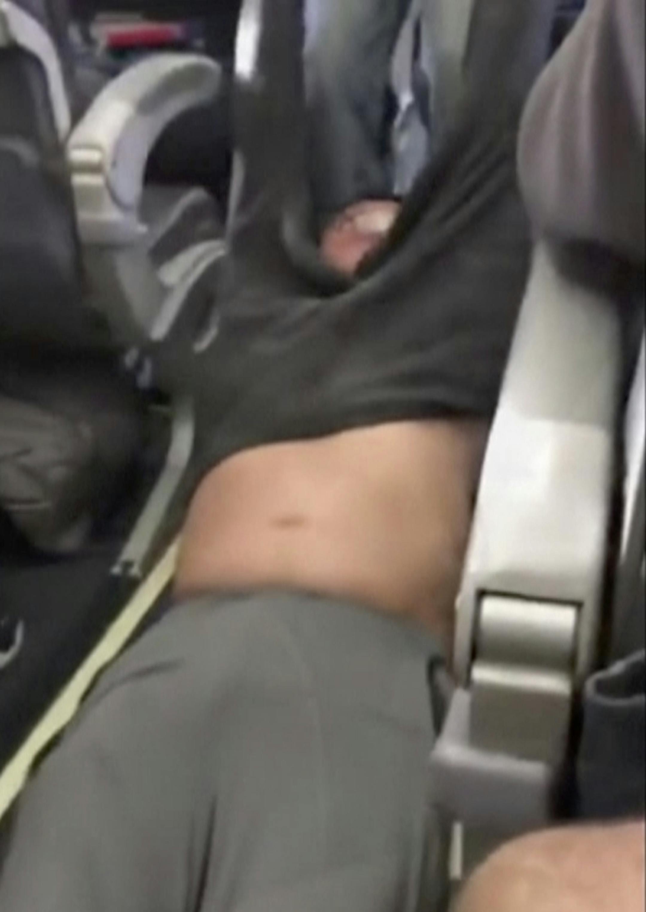 This Sunday, April 9, 2017, image made from a video provided by Audra D. Bridges shows a passenger being removed from a United Airlines flight in Chicago. Video of police officers dragging the passenger from an overbooked United Airlines flight sparked an uproar Monday on social media, and a spokesman for the airline insisted that employees had no choice but to contact authorities to remove the man. (Audra D. Bridges via AP)