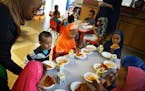 Prekindergarten children sat down to a dinner of fruit cocktail, pizza and milk at First Choice Child Care Center in Minneapolis.