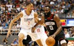 Los Angeles Clippers shooting guard Amir Coffey (7) guards Houston Rockets shooting guard James Harden (13) during the second quarter of an NBA presea