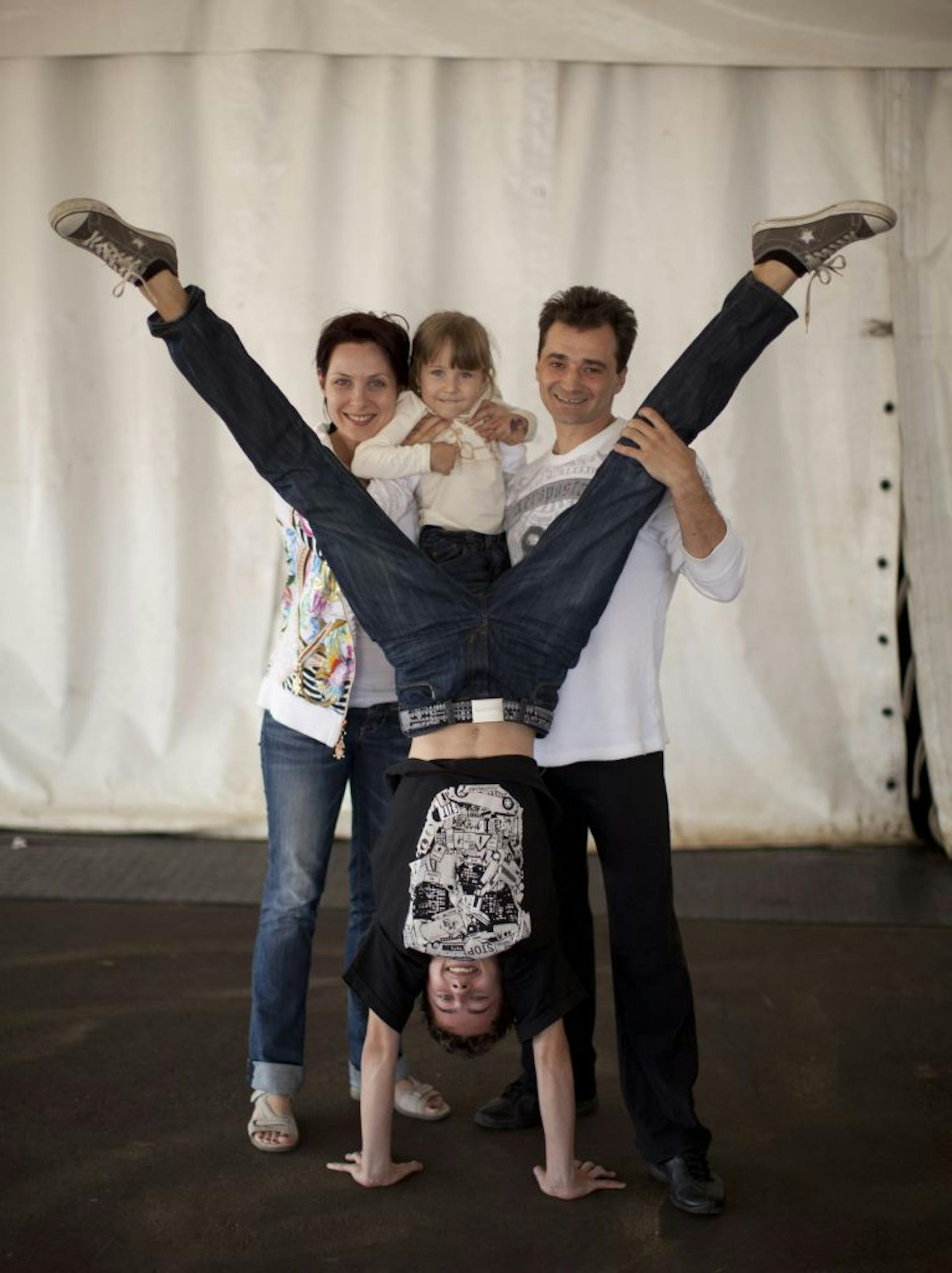 Svetlana Kashevarova, Dmitry Orel, and their children, Andrey, 15, and Anna, 4, Wednesday afternoon at Cirque du Soleil's encampment in Bloomington.
