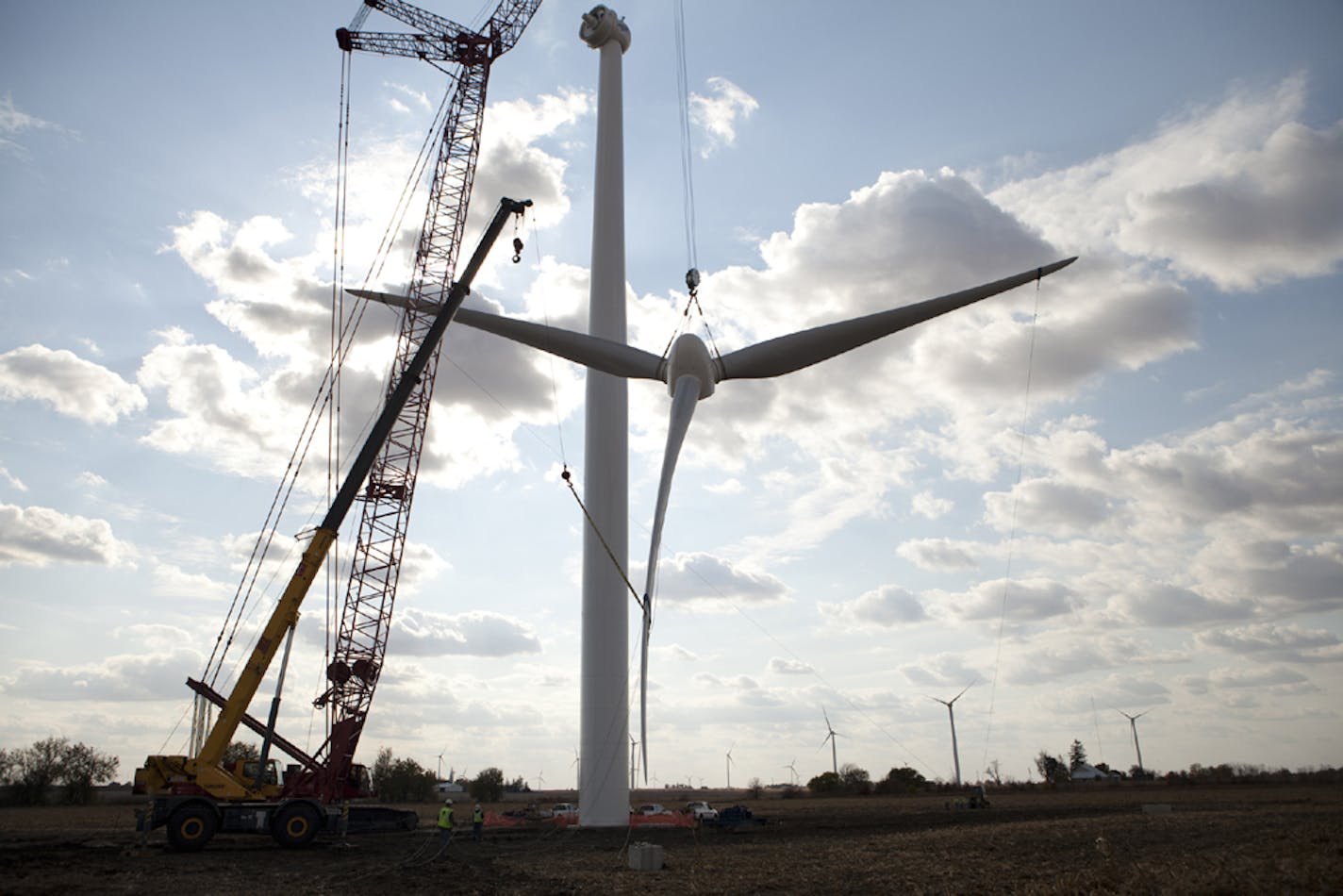 Wind turbines are reaching up to heights of 100 meters, or 328 feet, up from 80 meters, or 262 feet, which had been the standard height. With the extra height, developers hope to get steadier wind speeds. This turbine was erected by Mortenson Construction at the Shady Oaks Wind Farm in Compton, Ill.