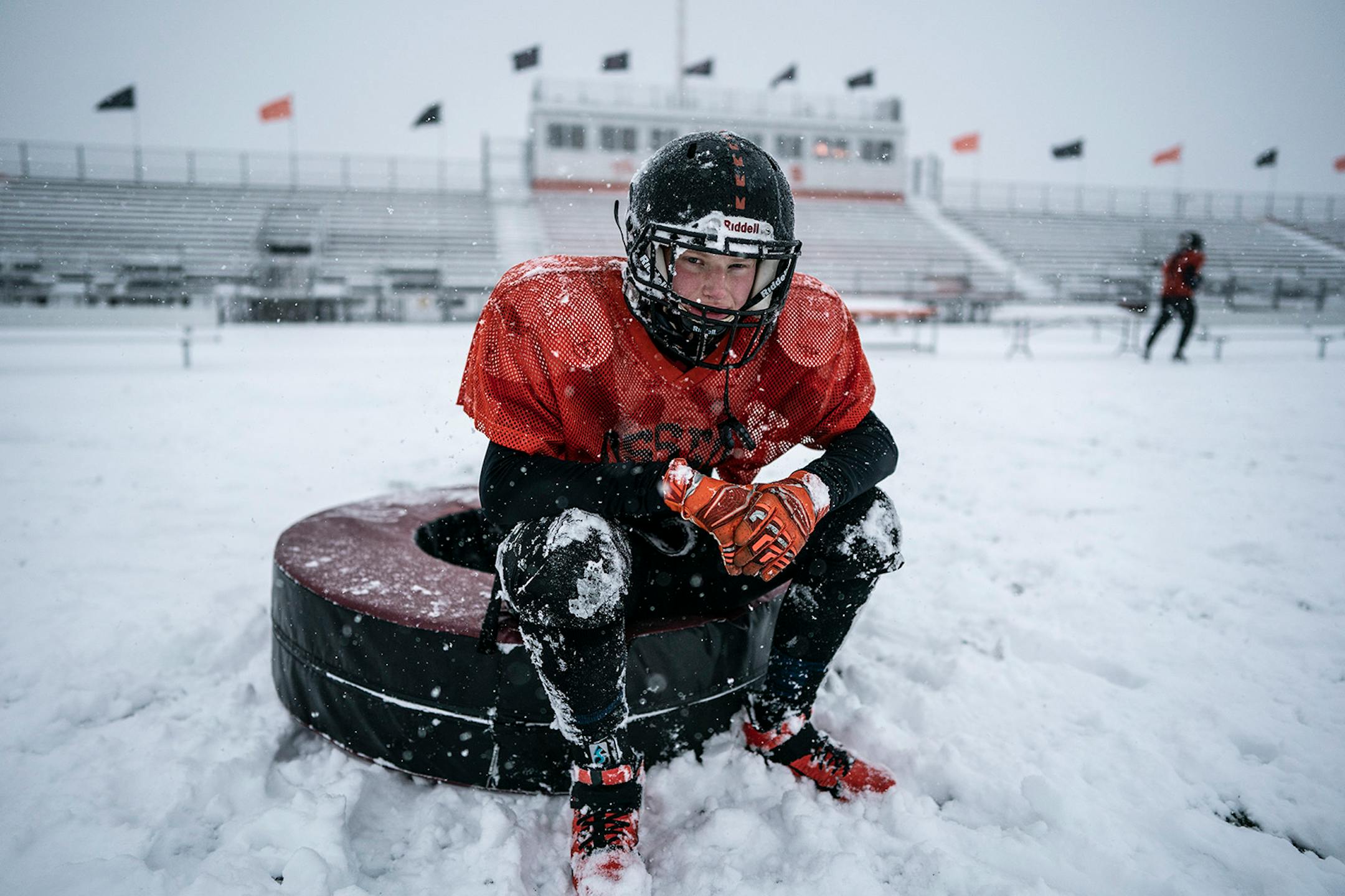 Osseo linebacker Michael Azure and teammates practiced outside in the heavy snow in preparation for their Friday night game against Totino-Grace.