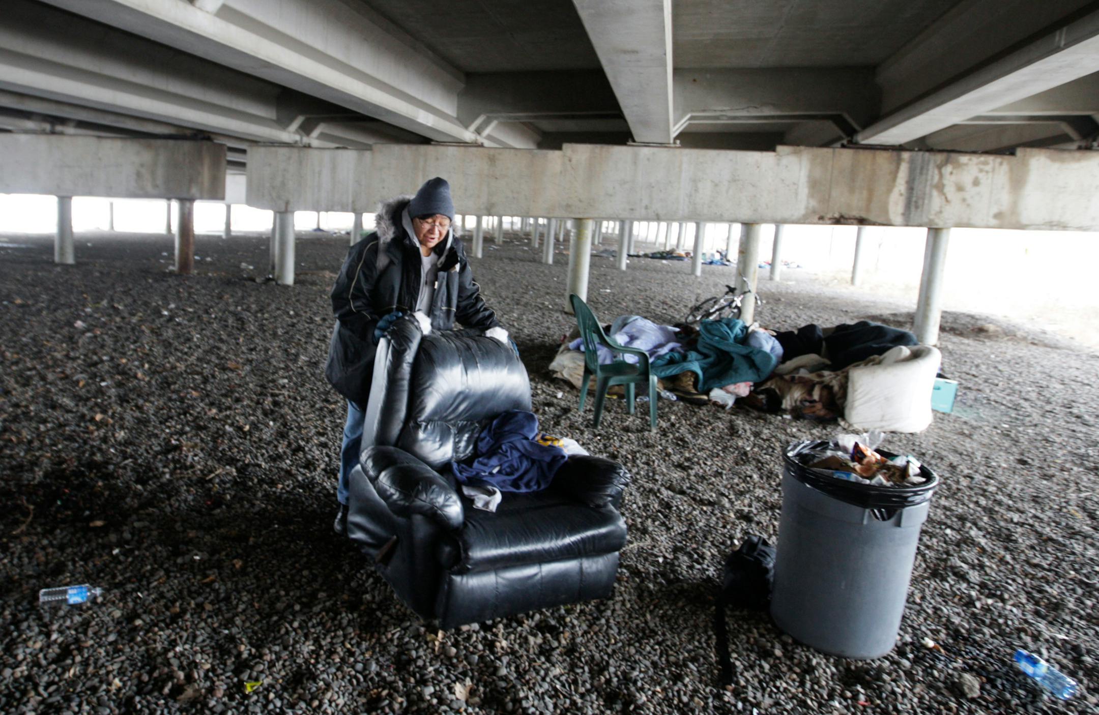 On a cold January day, Charlene Goggleye straightened out her "living room" beneath the Interstate 394 overpass on the edge of downtown Minneapolis. She was comforted later that day by a hug from the leader of the city's outreach program for the homeless.