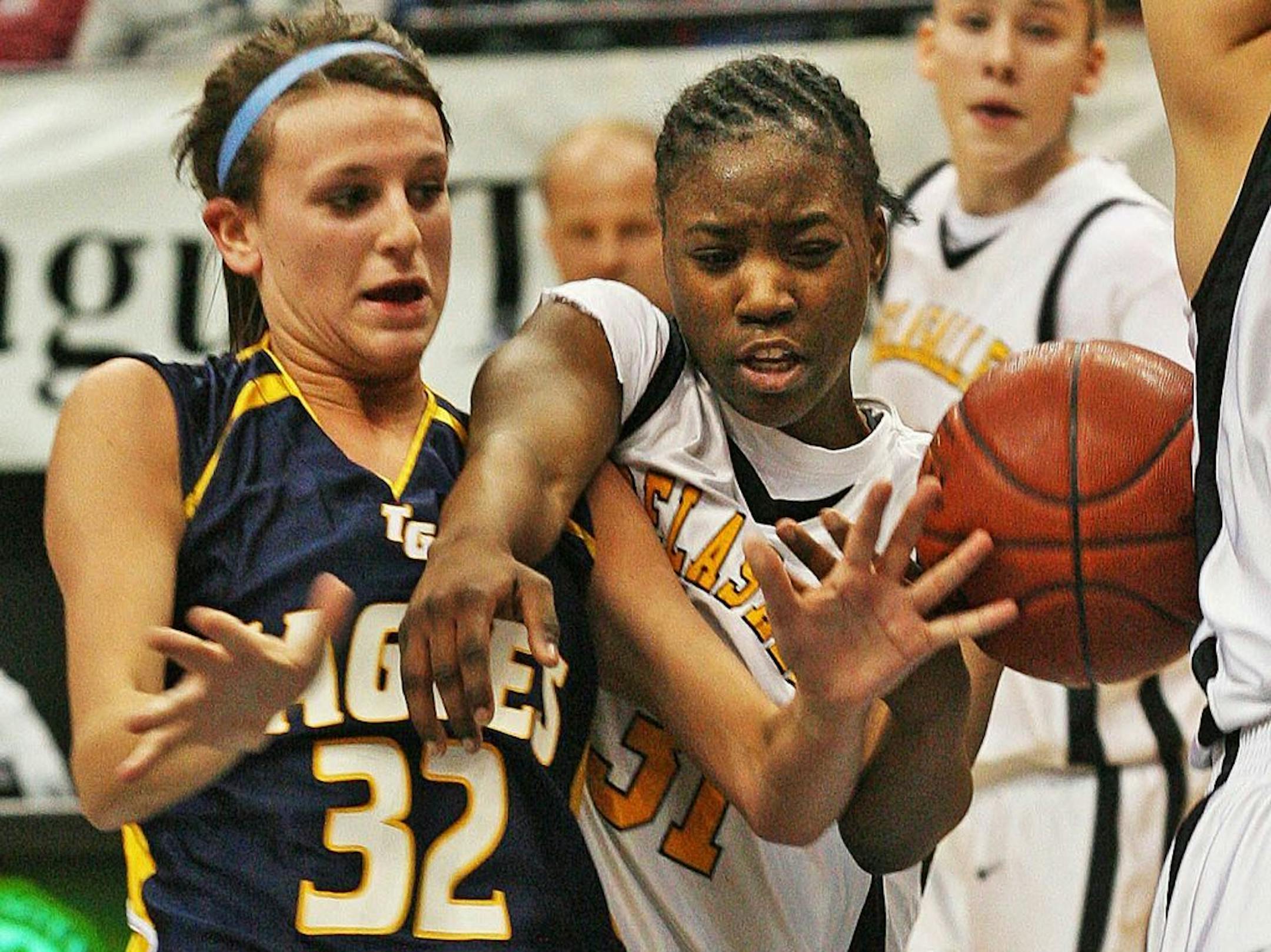 This March 15, 2008 photo shows Alexandra "Sasha" McHale, left, playing for Totino-Grace, battling DeLaSalle's Tori Rule for a rebound during a girls Class 3A basketball game in Minneapolis. Alexandra "Sasha" McHale, the daughter of Houston Rockets coach Kevin McHale died Saturday, Nov. 24, 2012, and the team disclosed no other details Sunday. She was 23. (AP Photo/The Star Tribune, Marlin Levinson ) MANDATORY CREDIT; ST. PAUL PIONEER PRESS OUT; MAGS OUT; TWIN CITIES TV OUT