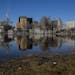 Downtown St. Paul reflected in the water flooding Harriet Island Regional Park on Monday afternoon.