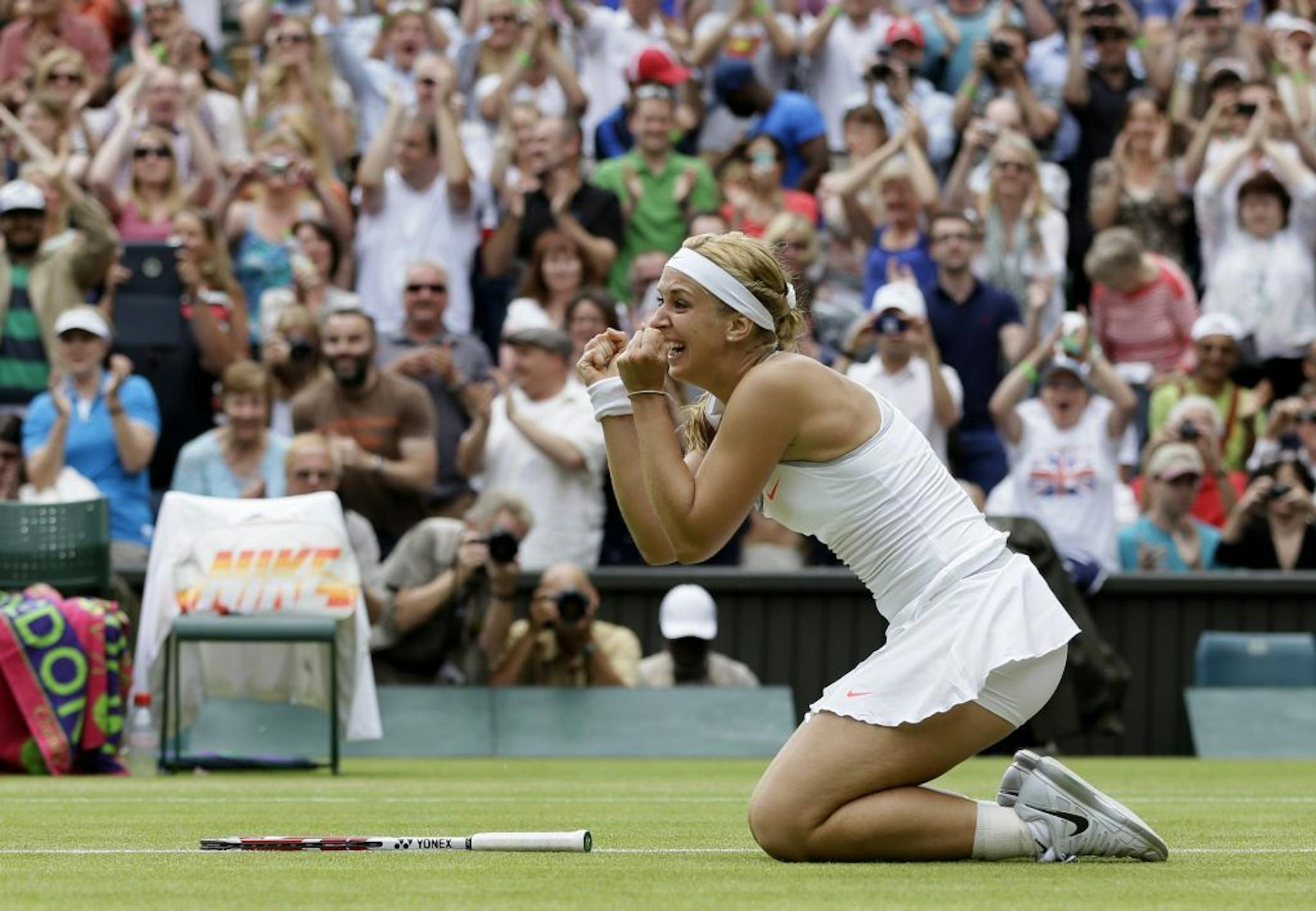 Sabine Lisicki of Germany reacts after beating Serena Williams of the United States in a Women's singles match at the All England Lawn Tennis Championships in Wimbledon, London, Monday, July 1, 2013.