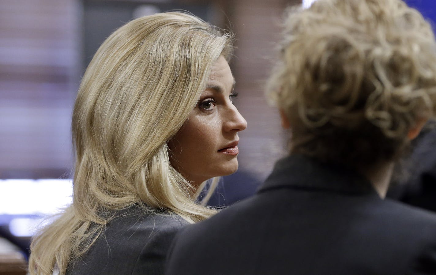 Sportscaster and television host Erin Andrews, left, attends court proceedings Wednesday, March 2, 2016, in Nashville, Tenn. Andrews has filed a $75 million lawsuit against the franchise owner and manager of a luxury hotel and a man who admitted to making secret nude recordings of her in 2008.