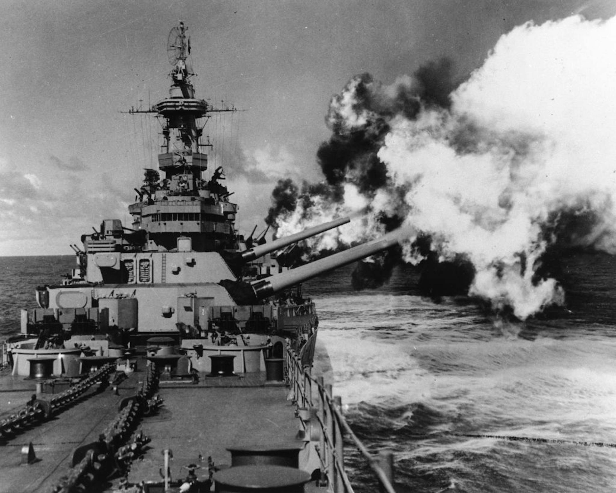 The battleship USS Missouri fires its guns during World War II