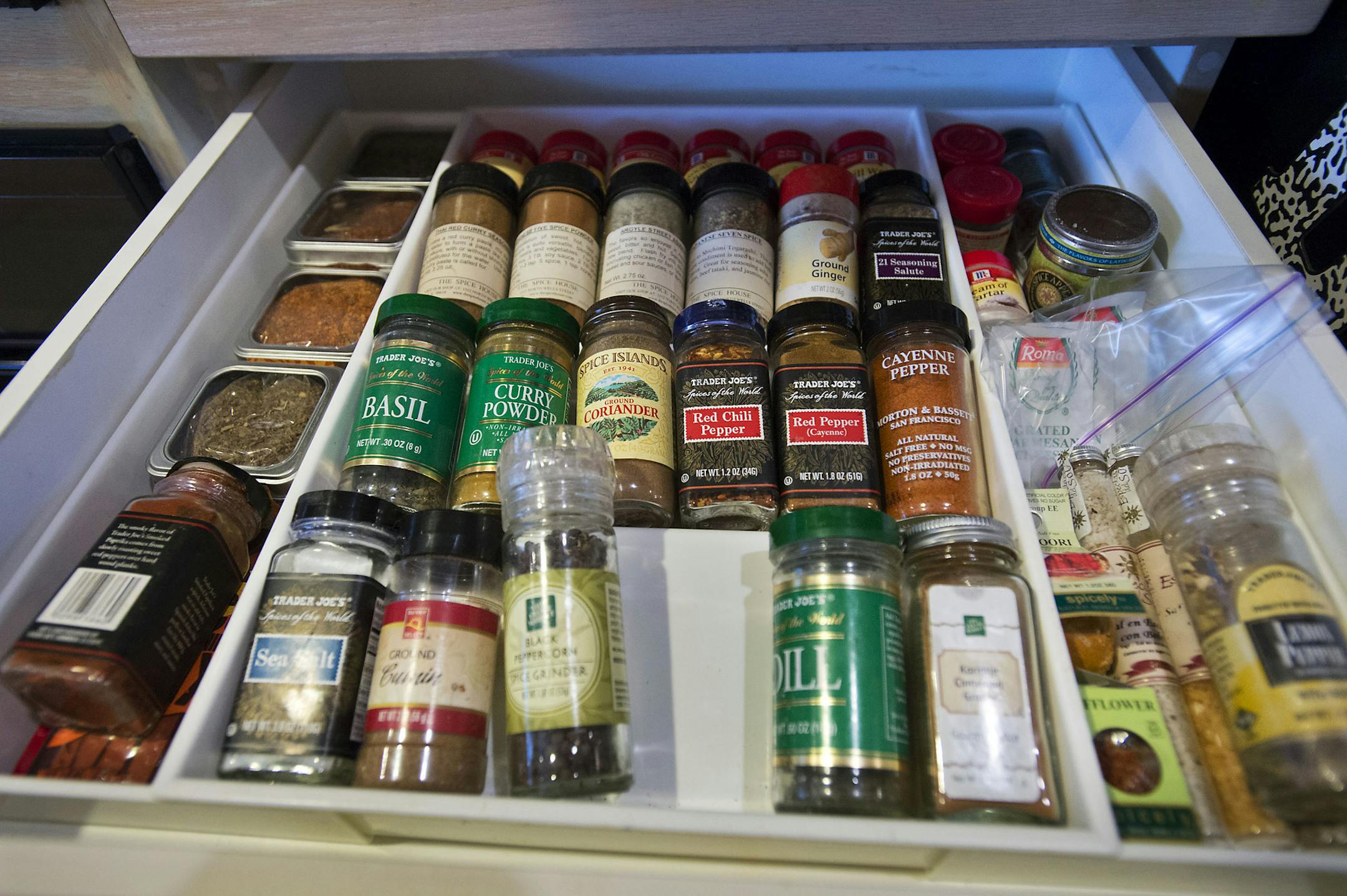 Local professional organizer Gwynnae Byrd turned a messy spice cabinet into a one-glance, easy-access drawer. (Randall Benton/Sacramento Bee/TNS) ORG XMIT: 1179396