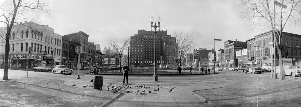 The Nicollet Hotel, middle, in 1960. The photo was taken from 2nd St. S. looking up Nicollet and Hennepin Avenues.