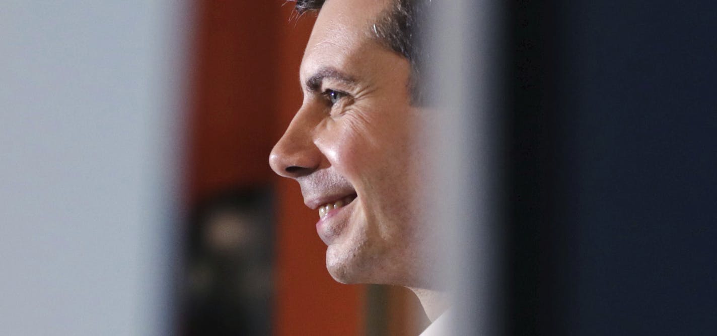 Democratic presidential candidate South Bend Mayor Pete Buttigieg smiles as he answers questions from employees during a campaign stop at a dairy company in Londonderry, N.H., Friday, April 19, 2019. (AP Photo/Charles Krupa)