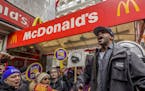 Days ahead of Andy Puzder's confirmation hearing for labor secretary, fast food workers in the fight for 5 took their opposition to downtown New York'