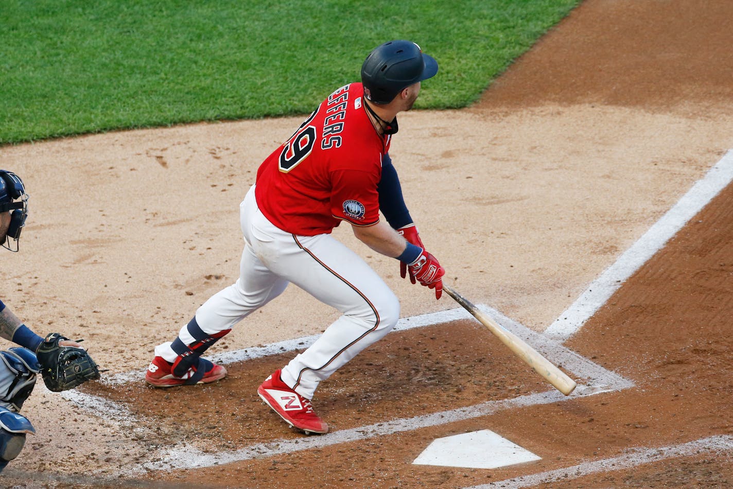 Ryan Jeffers hits an RBI single off Brewers pitcher Brandon Woodruff on Thursday.