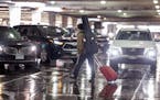 Travelers navigate the rideshare area in Terminal 1 at the Minneapolis-St. Paul International Airport on March 22.