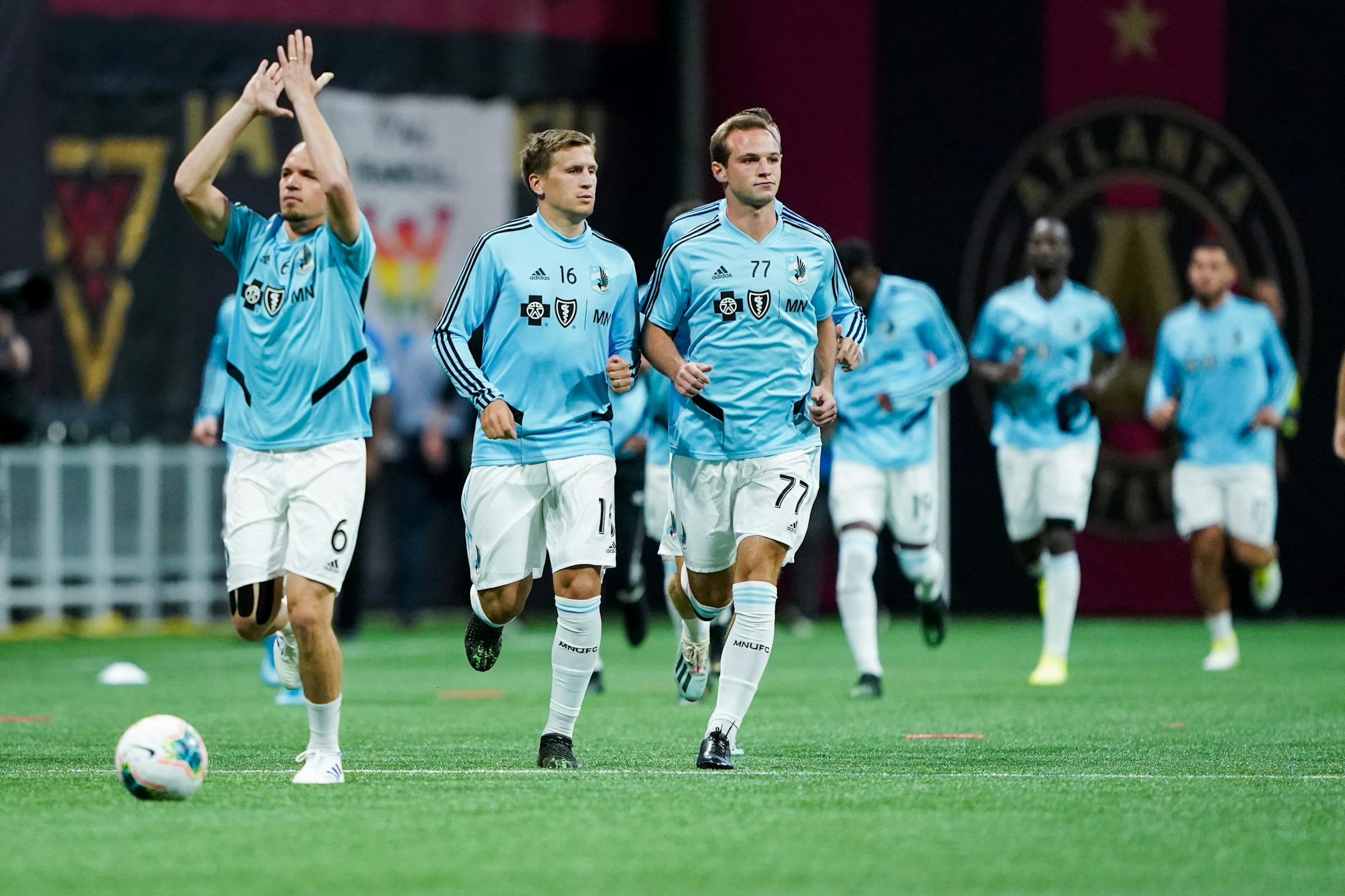 Minnesota United midfielder Osvaldo Alonso (6) applauds Minnesota fans as he and teammates run on to the field for warm ups