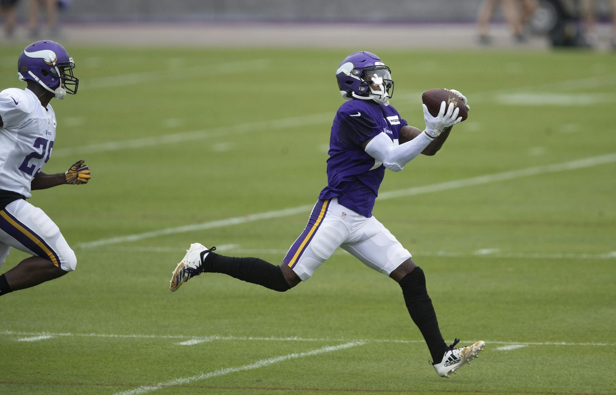 Minnesota Vikings wide receiver Stefon Diggs (14) pulled down a catch over cornerback Xavier Rhodes (29) during practice at TCO Performance Center on Sunday July, 28 2019 in Eagan, MN.