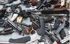 Guns seized during a raid by law enforcement officials.