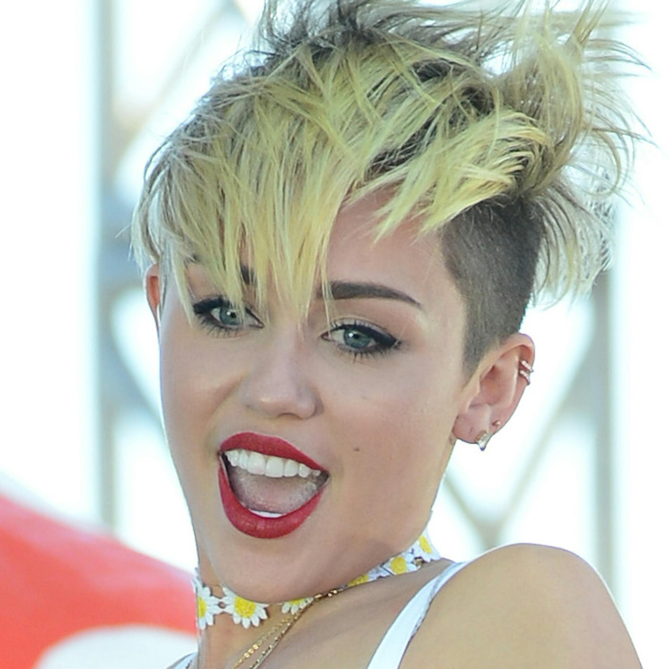 Miley Cyrus performs at IHeartRadio Music Village, Saturday, Sept. 21, 2013 in Las Vegas. (Photo by Al Powers/Powers Imagery/Invision /AP) ORG XMIT: MIN2013100210255808