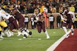 Gophers running back Mohamed Ibrahim (24) helped the team move away from its own end zone in the fourth quarter of Saturday’s game at Huntington Ban