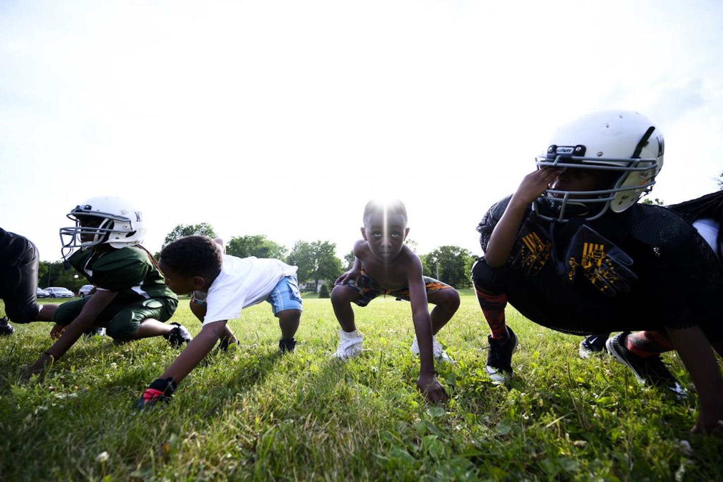 Kids, mostly 8 and 9 but some younger, on the Minnesota Jays practiced their 3-point stances after the different age-group teams broke up into separate groups during practice Wednesday night at Bryn Mawr Meadows Park, 3-plus miles away from Jordan Park, where gunfire broke up a recent practice.