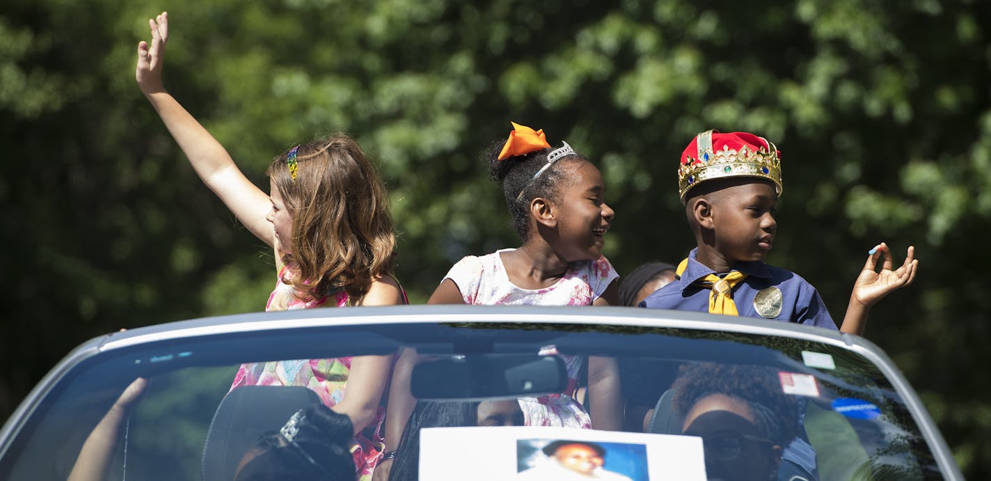 From left, Amanda Grein, 10, Anaiya Wilson, 6, and Robert Tisdale, 7, greeted the crowd as they rode in a Ford Mustang in front of other pageant contestants. This pageantry line rode in memory of Lou Wiley, who contributed many years to the pageant. ] Isaac Hale &#xef; isaac.hale@startribune.com The annual Rondo Days Festival kicked off with a parade in St. Paul on Saturday, July 16, 2016. The festival remembers the African-American community of Rondo, which was destroyed by I-94's construction