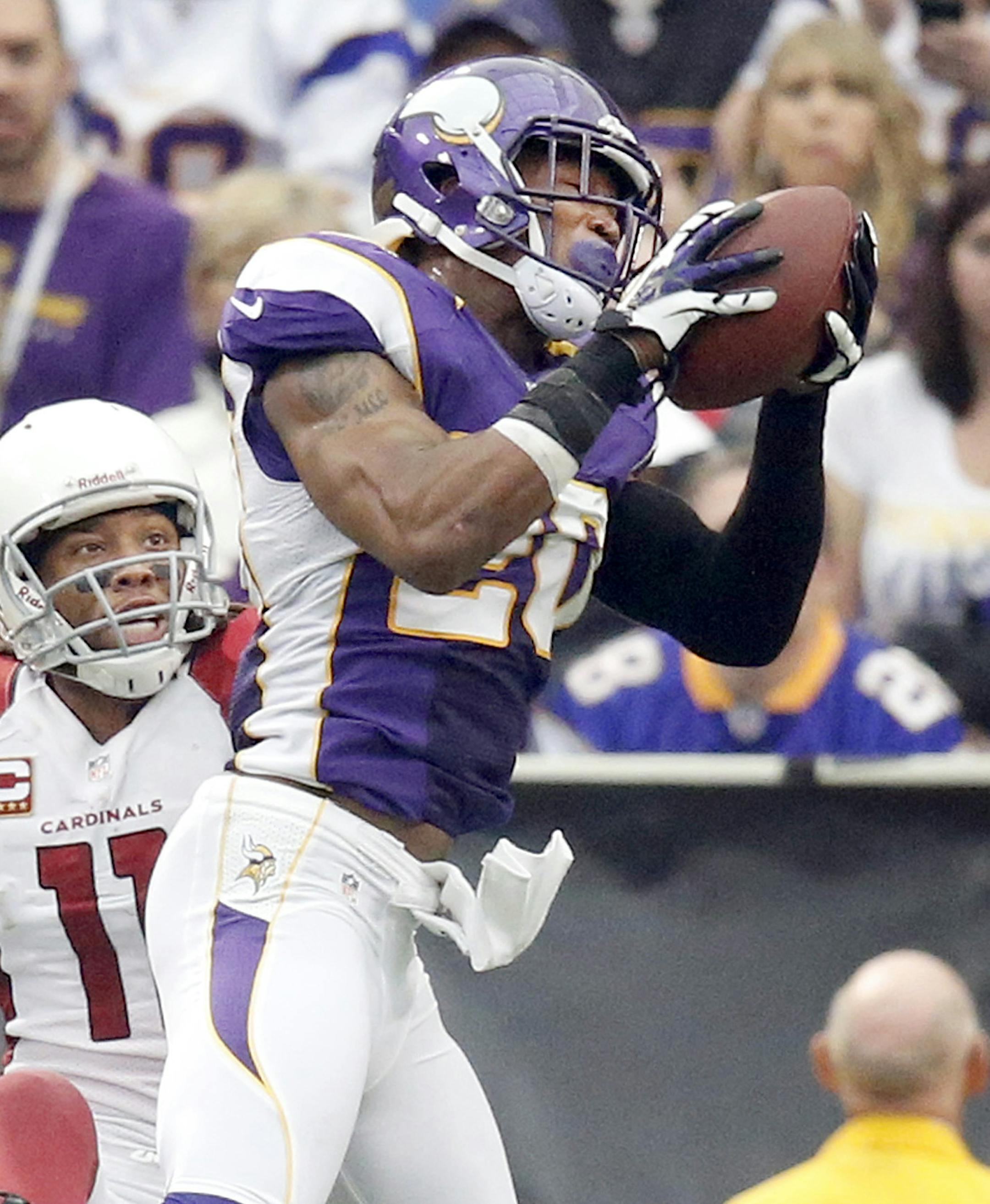 Vikings Chris Cook (20) caught a pass intended for Larry Fitzgerald (11) in the third quarter. The would be interception was called back due to an off sides penalty on the Vikings defense. ] CARLOS GONZALEZ cgonzalez@startribune.com - October 21, 2012, Minneapolis, Minn, Mall of America Field, The Metrodome, NFL, Minnesota Vikings vs. Arizona Cardinals