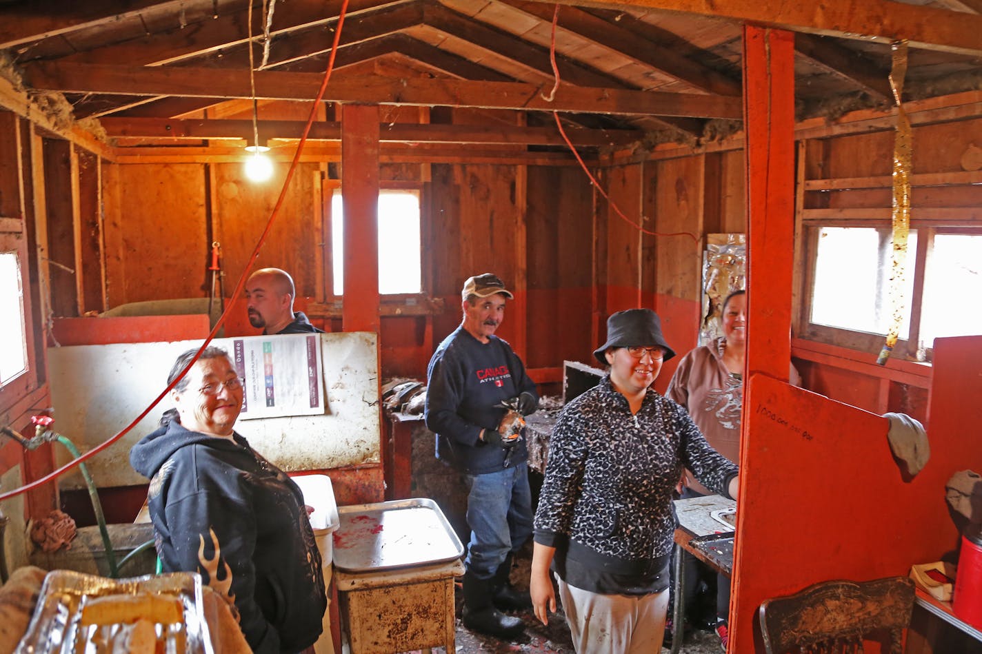 Floyd Lavallee, center, and members of his family clean ducks at the Sports Afield Duck Club in St. Ambroise, Manitoba. At left is Floyd's wife, Noella; their son, Gregory, 35; daughter, Margaretann, 23; and daughter Samantha, 42. Floyd started cleaning ducks in 1961, and Noella began when she was pregnant with Gregory.