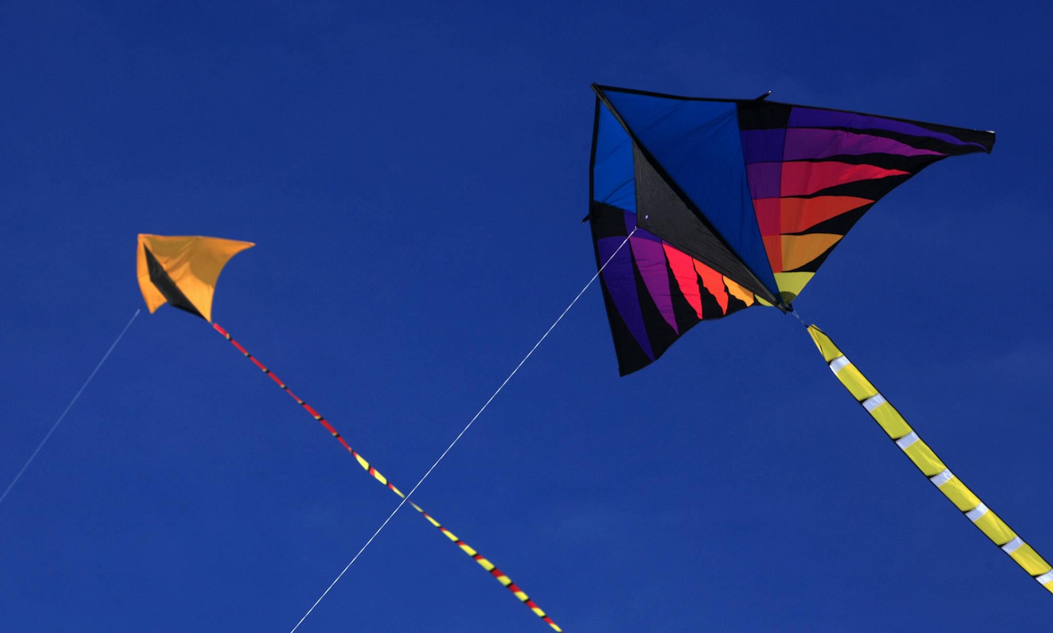 David McKeen of St. louis Park spent the afternoon flying his three kites on Lake Calhoun. David McKeen said, "With the wind and the temperature at 30 degress, it is a perfect day to fly my kites. There just haven't been many days like this.". David is a gardener at the Minneapolis Golf Club and was attending a convention in the morning and late afternoon. Time between his seminars gave him enough time to fly his kites. Minneapolis, MN on January 9, 2013. ] JOELKOYAMA&#xe2;&#x20ac;&#xa2;joel.koy