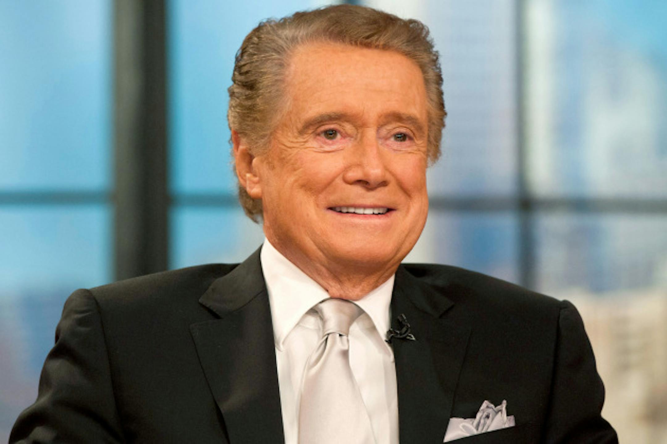 Regis Philbin appears on his farewell episode of "Live! with Regis and Kelly", in New York, Friday, Nov. 18, 2011. After more then 28 years, Philbin signed off U.S. morning television on Friday, long after setting a world record for the most time on TV. Philbin, 80, has logged more than 17,000 hours on television in a career that dates back to the 1960s. He gained prime-time fame as host of "Who Wants to Be a Millionaire" a decade ago. But his enduring impact was as a morning show host, turning stories about something as simple as a dinner out on the town into compelling viewing. (AP Photo/Charles Sykes)