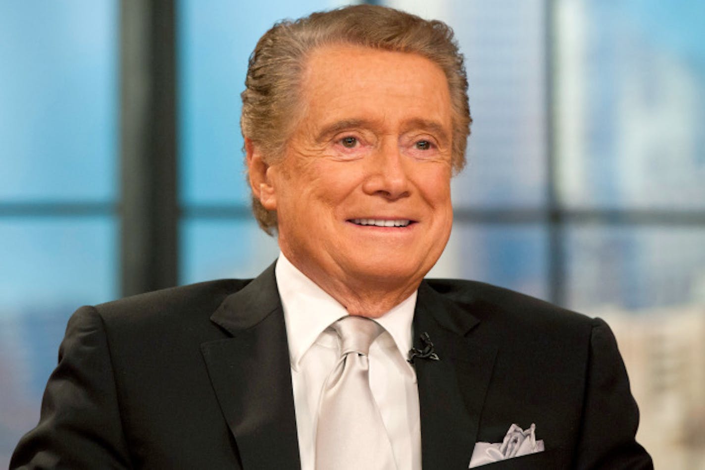 Regis Philbin appears on his farewell episode of "Live! with Regis and Kelly", in New York, Friday, Nov. 18, 2011.  After more then  28 years, Philbin signed off U.S. morning television on Friday, long after setting a world record for the most time on TV.   Philbin,  80,  has logged more than 17,000 hours on television in a career that dates back to the 1960s. He gained prime-time fame as host of "Who Wants to Be a Millionaire" a decade ago. But his enduring impact was as a morning show host, turning stories about something as simple as a dinner out on the town into compelling viewing.   (AP Photo/Charles Sykes)