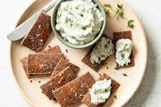 Serve Hazelnut Parmesan Crackers with herbed cream cheese. Credit: Mette Nielsen, Special to the Star Tribune