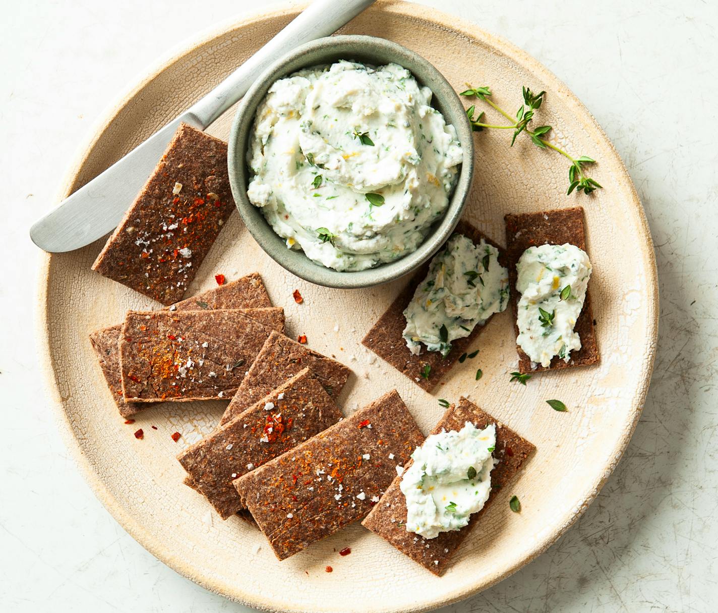 Serve Hazelnut Parmesan Crackers with herbed cream cheese. Credit: Mette Nielsen, Special to the Star Tribune