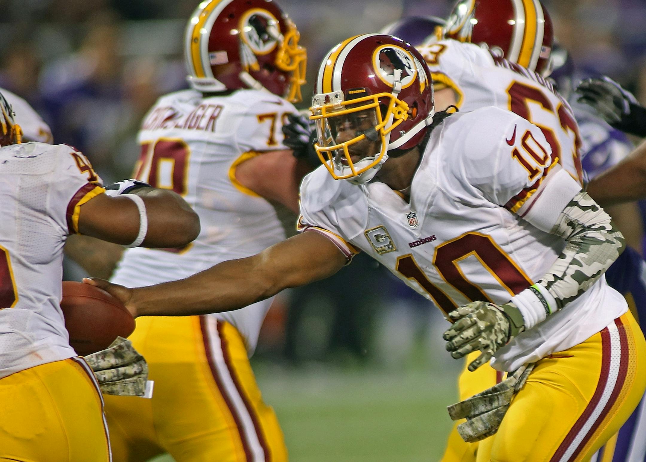 Washington Redskins quarterback Robert Griffin III (10) handed the ball off to Washington Redskins running back Alfred Morris (46) in the third quarter as the Vikings took on the Washington Redskins, Thursday, November 7, 2013 at Mall of America Field in Minneapolis, MN. (ELIZABETH FLORES/STAR TRIBUNE) ELIZABETH FLORES � eflores@startribune.com