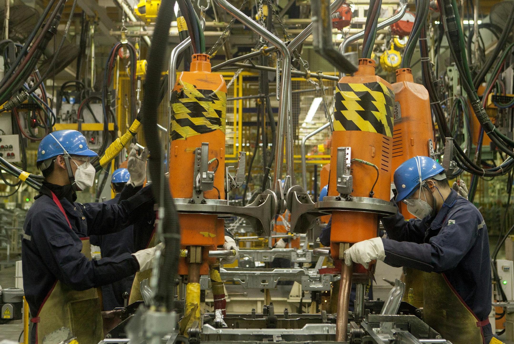 The assembly floor at Ford’s newest car plant in Hangzhou, China, April 11, 2017. Though blue-helmeted workers still do some welding at this state-of-the-art factory, much of the work has been automated through robots. (Giulia Marchi/The New York Times)