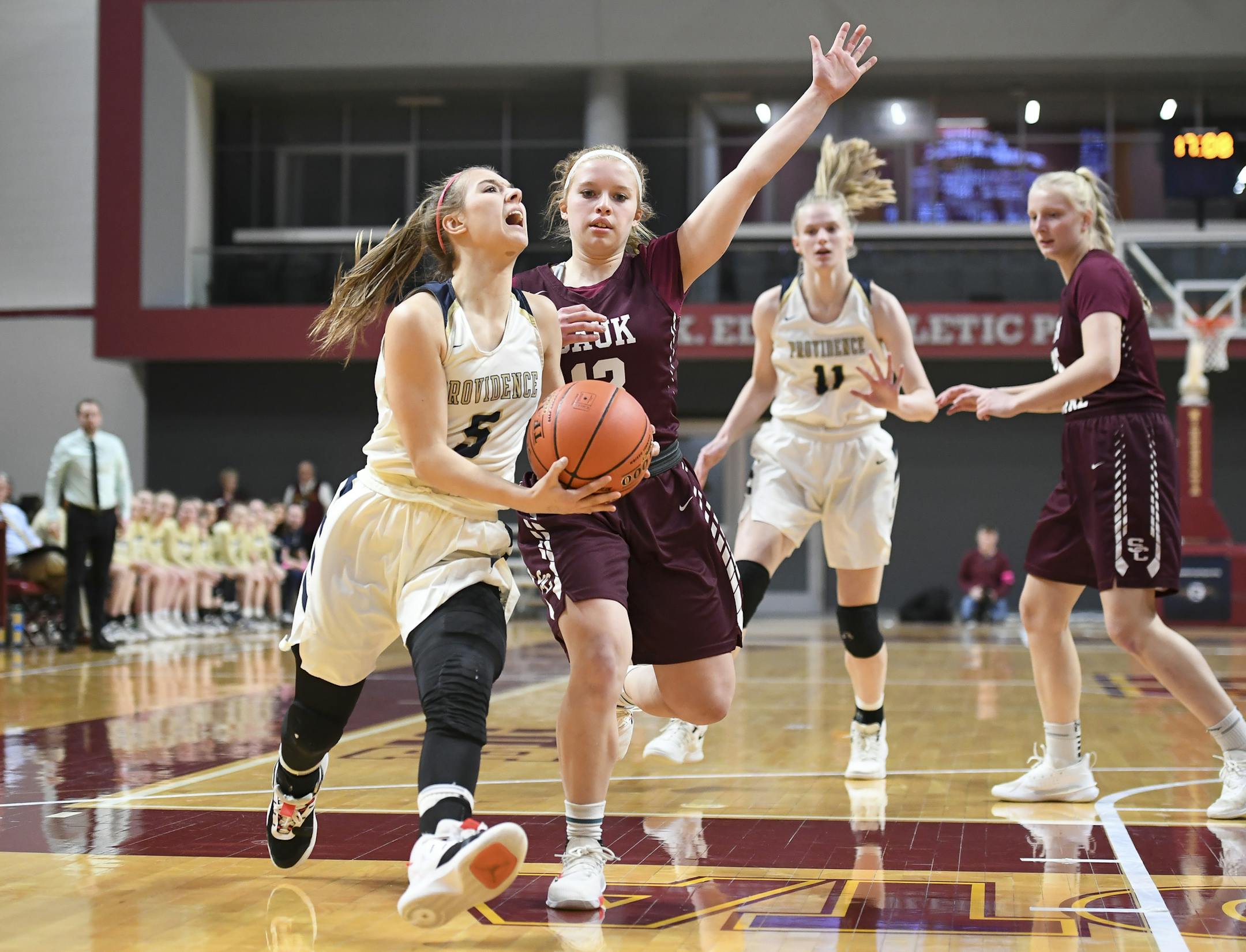 Providence Academy guard Hailey Hohenecker (5) drove toward the basket for a layup with Sauk Centre guard Megan Klaphake (13) in pursuit during the first half. ] Aaron Lavinsky • aaron.lavinsky@startribune.com Sauk Centre played Providence Academy in a Class 2A state tournament girls basketball quarterfinal game on Wednesday, March 11, 2020 at Maturi Pavilion in Minneapolis, Minn..